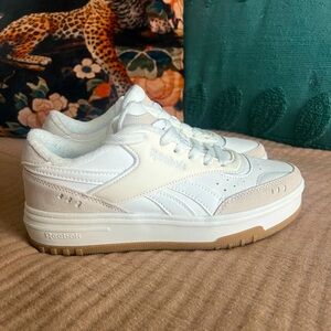 Reebok cream and white sneakers